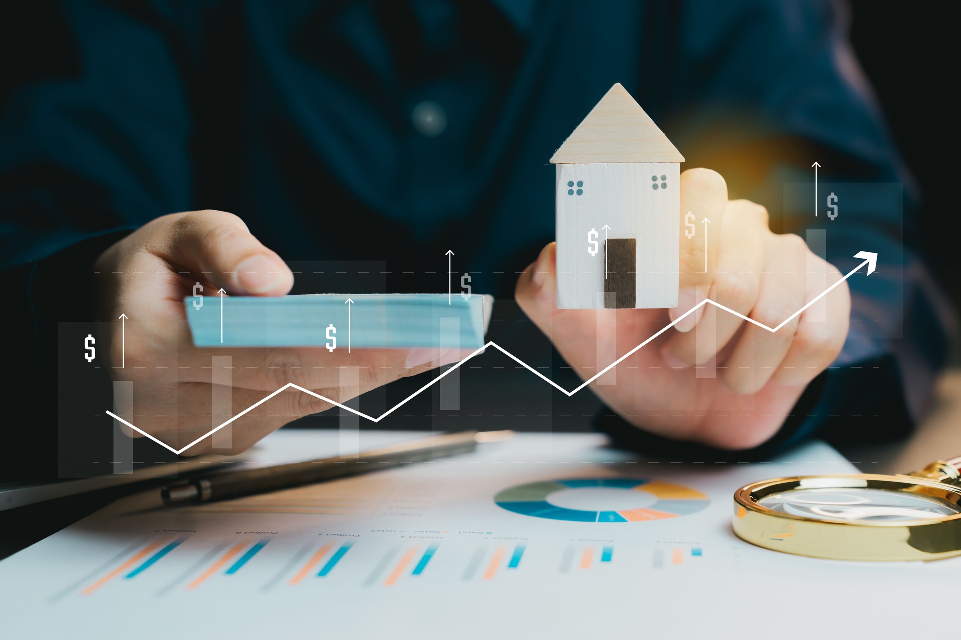 Hands Holding Model House and Chart Showing Growth in Real Estate, business concept